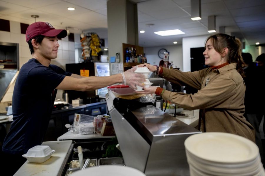 Bobcat Den worker Roman Hudgins ’21 hands over a Den Delivery food order to Olivia Kranefuss ’22 in 2019. Den Delivery is one of the most established student-run businesses on campus.