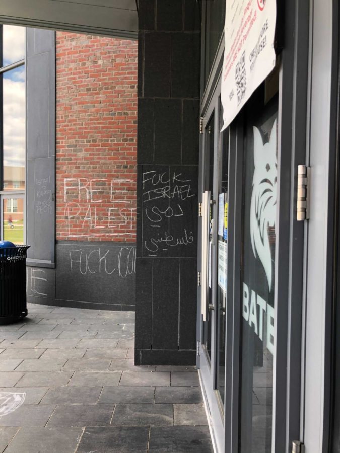 Depicted above is the initial chalk graffiti on Commons pictured on  May 9. The messages read Free Palestine and [expletive] Israel. [expletive] colonialism is also partially visible. 