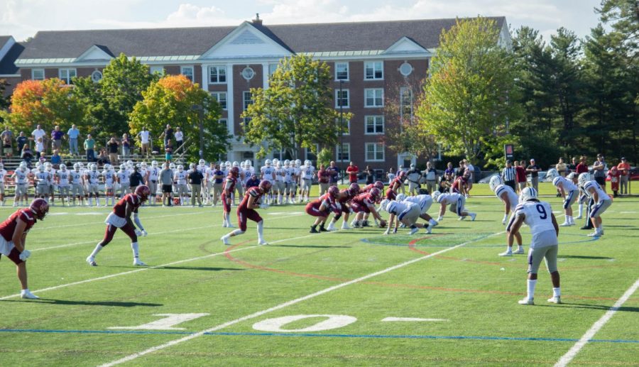 The Bates football team lines up against Amherst. The team could not defeat the Mammoths, continuing the 21-year loss streak.