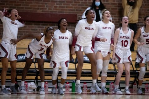 The women’s basketball team celebrates during their dramatic and impressive win over No. 3 nationally ranked Amherst on Friday night.