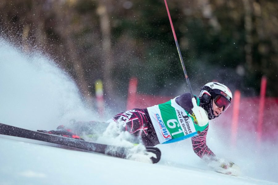 The rise in artificial snow, partially due to climate change, is changing the way athletes across the globe (and at Bates) ski. Here: Marat Washburn ‘25 in an alpine skiing race.