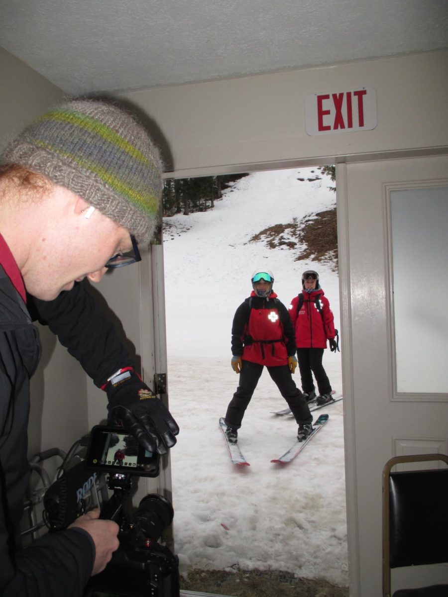 Mac Gaither behind the camera at Lost Valley filming Amanda Yolles, director of MaineLines for the ski patrol section of the film 