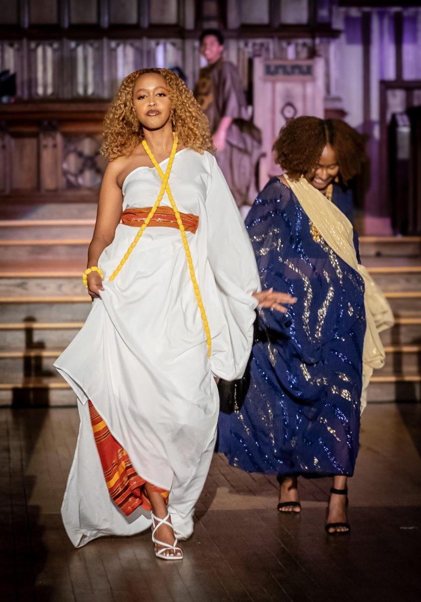 Students walk across the stage of Gomes Chapel at the Africana Fashion Show. (Photo provided by Mark Mattos at markmattosphotography.com)