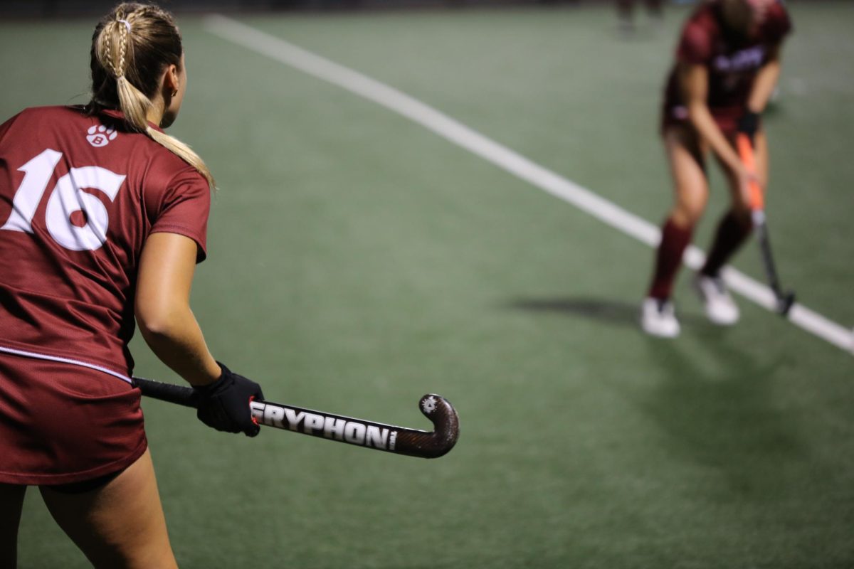 Number 16, Haley Dwight '27, keeps a careful eye on the ball during the Women's Field Hockey game on Tuesday, Sept. 24.