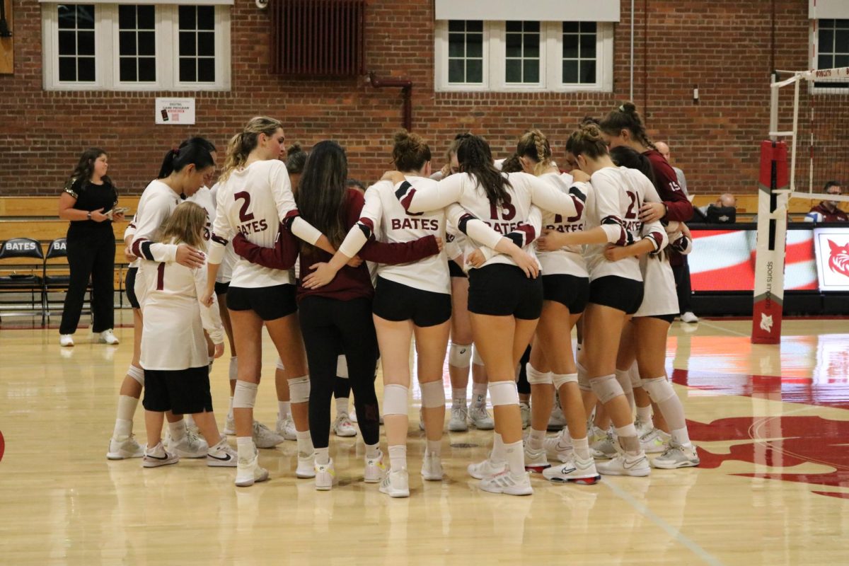 Women's Volleyball team huddle before their match against Amherst on Friday, Sept. 20. 