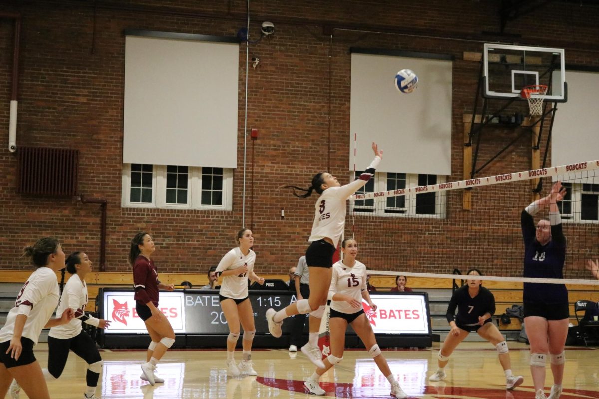 On the court with Women's Volleyball as Ami Evans, Class of '26 spikes the ball at the NESCAC Home Opener on Friday, Sept. 20. 