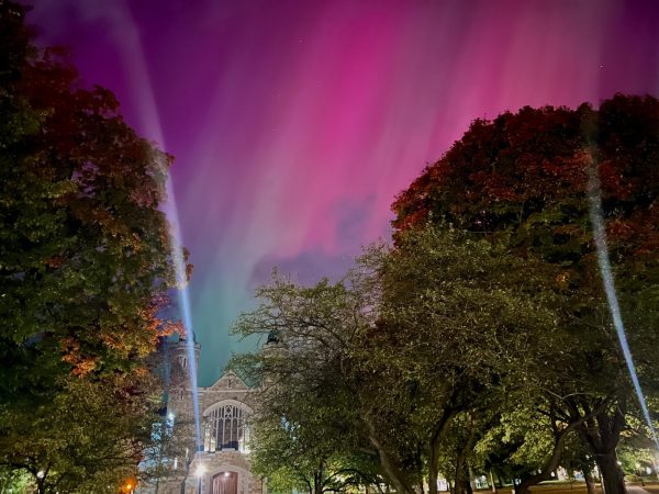 The northern lights appear above Gomes Chapel on Oct. 10.