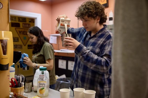 Bissan Kablawi ‘26 and Reynolds Huard ‘27 serve customers at the Ronj on Oct. 7. Despite the coffee shop’s success, it received major budget cuts from Campus Life this school year.