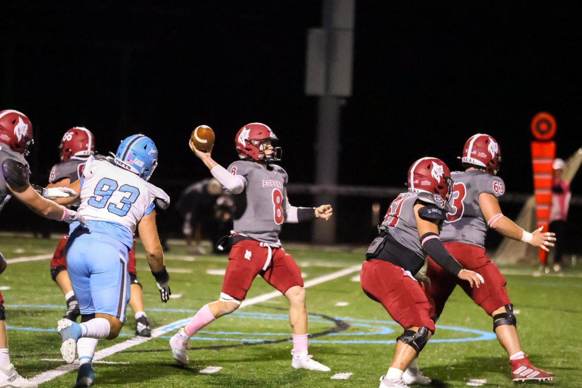 Colton Bosselait '25 Making a pass against Tufts.