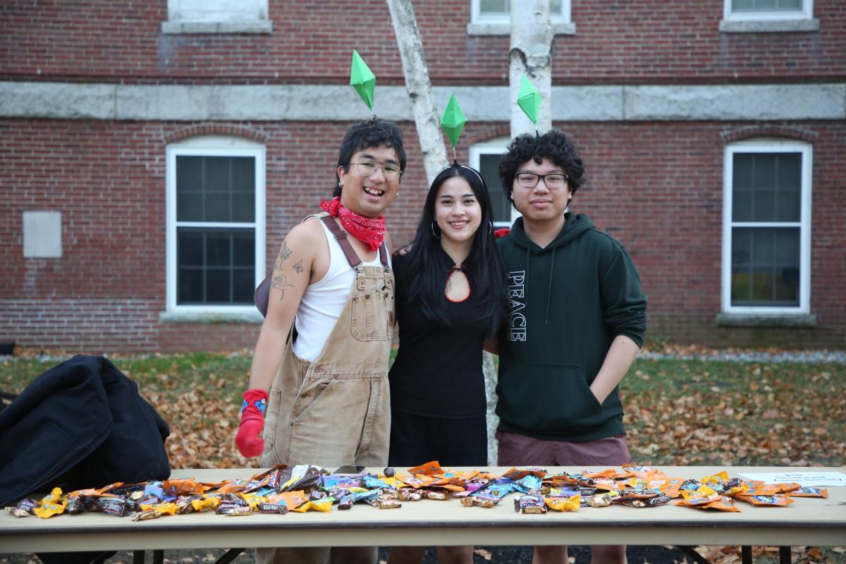 Members of the Bates Southeast Asia Society pose at their Sims themed table. (Right to Left: Johnny Michareune ‘25, Alex Georgiadis ‘26, Joaquín Torres ‘25)