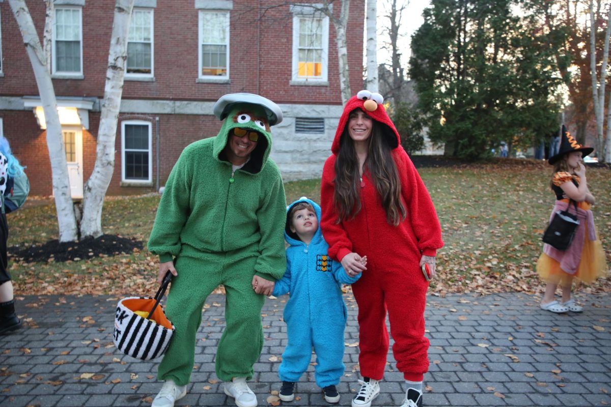 Jessica Horn, Jace, and John Valentin from Turner, ME pose with their Sesame Street themed family costumes. They drove at least two towns over to spend Halloween at Bates.