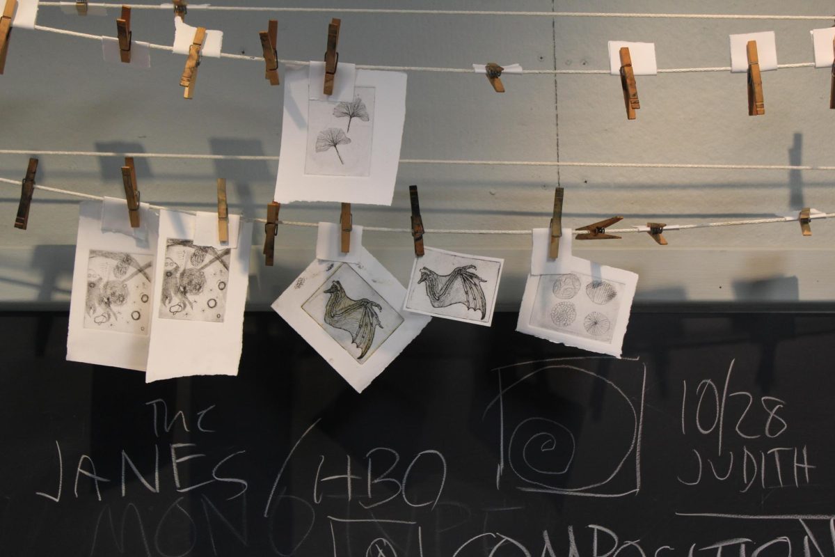 Prints hanging on a clothesline in the printmaking studio in Olin Arts Center on Sunday, November 10th.