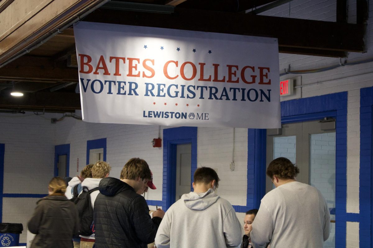 Bates volunteers help students register at the Armory