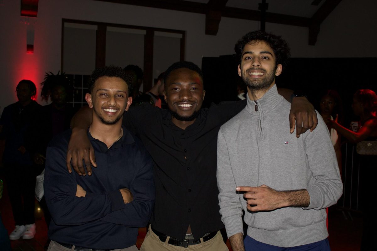 Natnael Yaregal ‘25, Anotida Viazhero ‘25, Krishna Kakani '25 (left to right) pose at Afro Gala