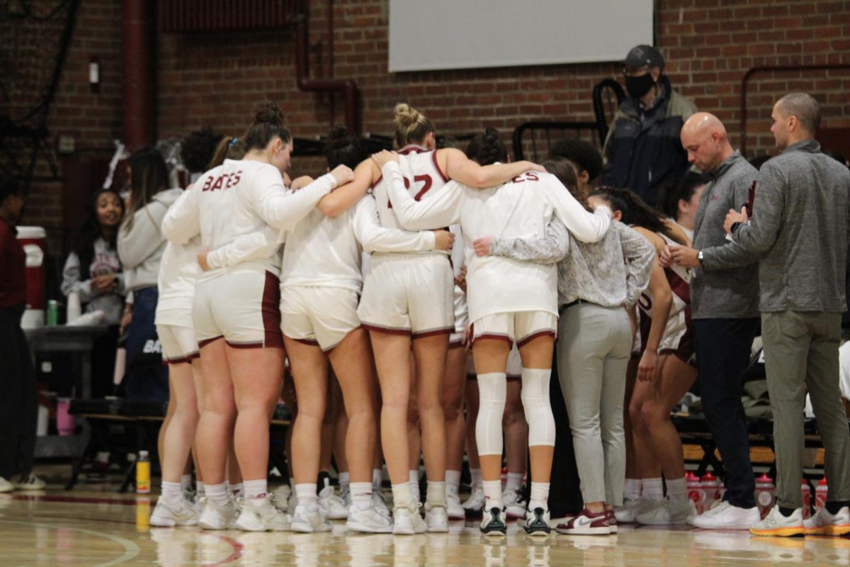 The Bates women's basketball team huddling before the start of their home opening game at Alumni Gym on Friday, November 15th. 