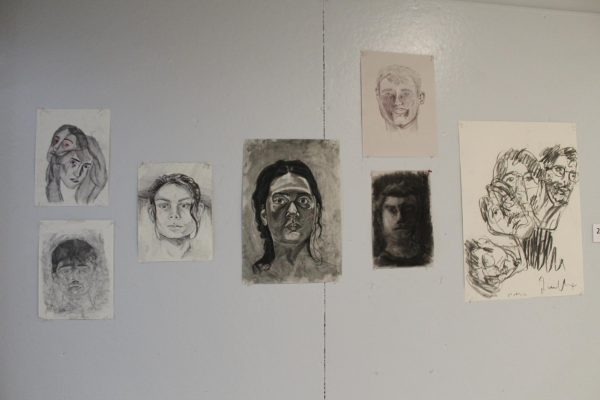 Bates students exhibit their work outside the drawing studio in Olin Arts Center.