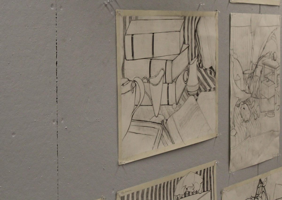 Student still-life drawings are displayed outside the drawing studio in Olin Arts Center.