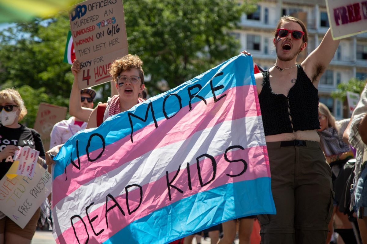 Marchers at the Denver Pride Parade, where the author is from, display support for trans children. New marginalizing regulations on gender affirming care from the Trump Administration will be detrimental for queer youth.