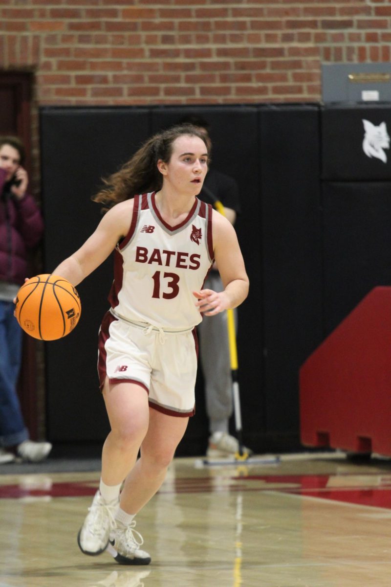 Sarah Hughes '27 dribbles down the court during the Bates vs. Bowdoin game at Alumni Gym on Friday, January 17th. 