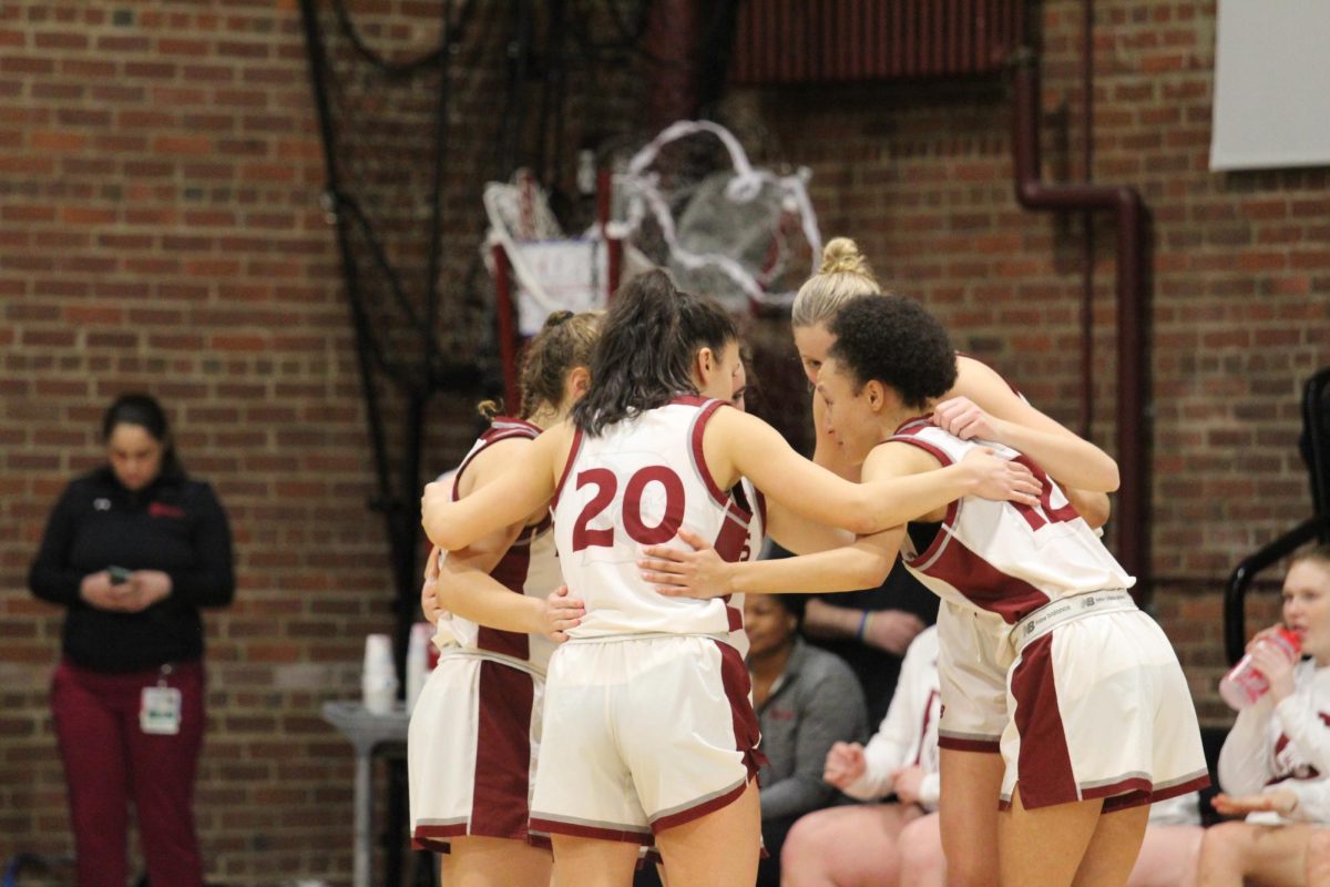 The starting lineup of the Bates' Women's basketball team gathers before the start of their game against Bowdoin on Friday, Jan. 17.