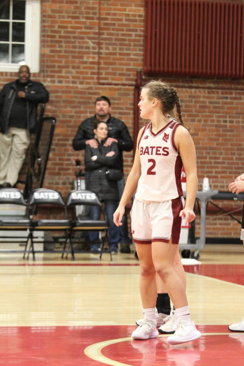 Sophie Spolter '26 watches the opposing team carefully during the Bates vs. Bowdoin game.