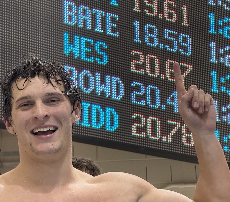 Max Cory '26 celebrates his DIII record 50-meter freestyle relay split time of 18.59 seconds.