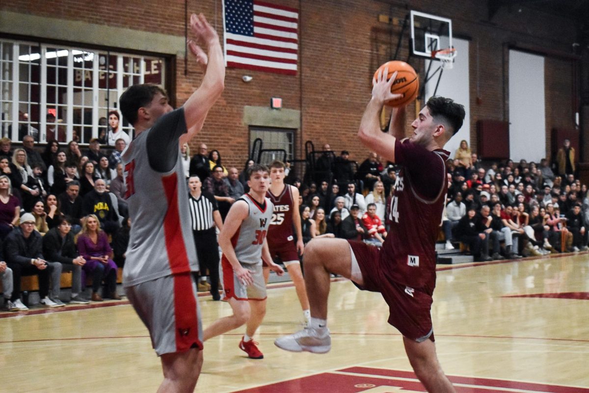 Brady Coyne '26 going for the layup.