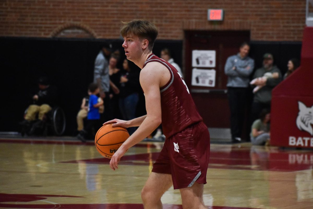 Keenan Sparks '28 dribbling the ball during the Bates vs. Wesleyan game.