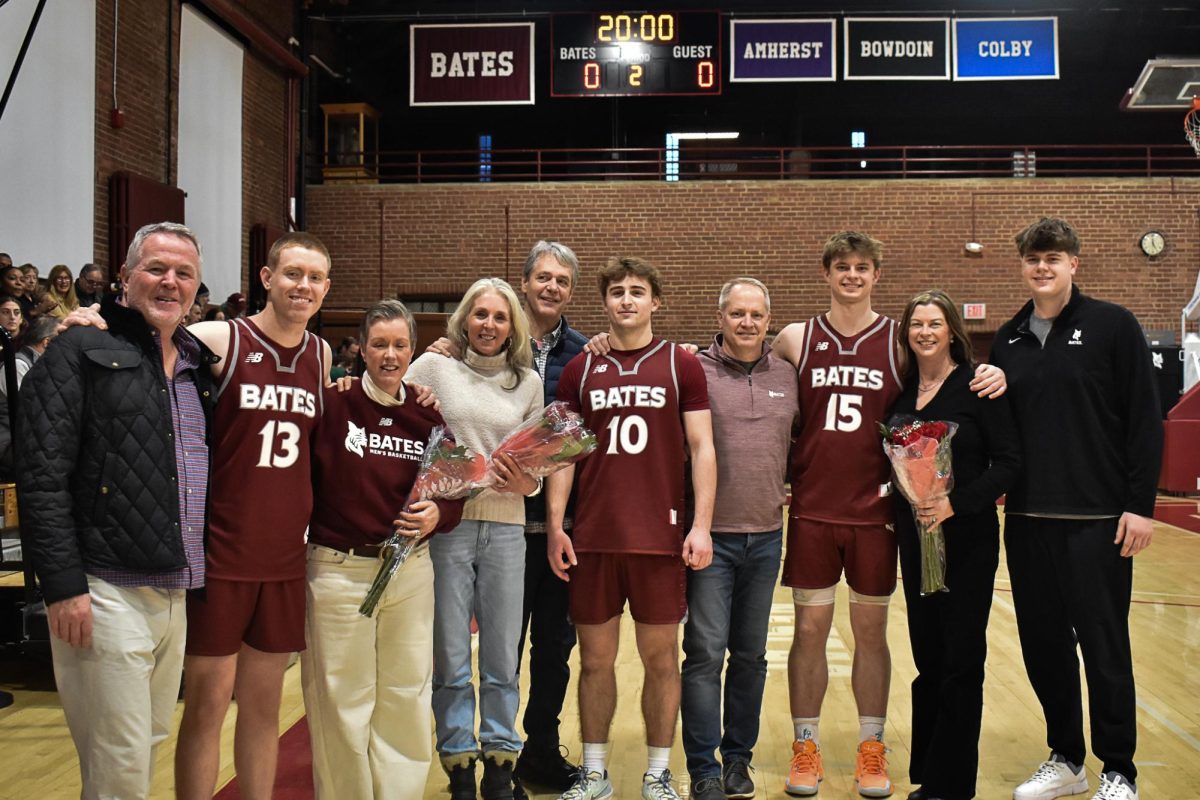 Group picture of all seniors and  on the Bates Men's Basketball team as well as their parents for Senior Day.