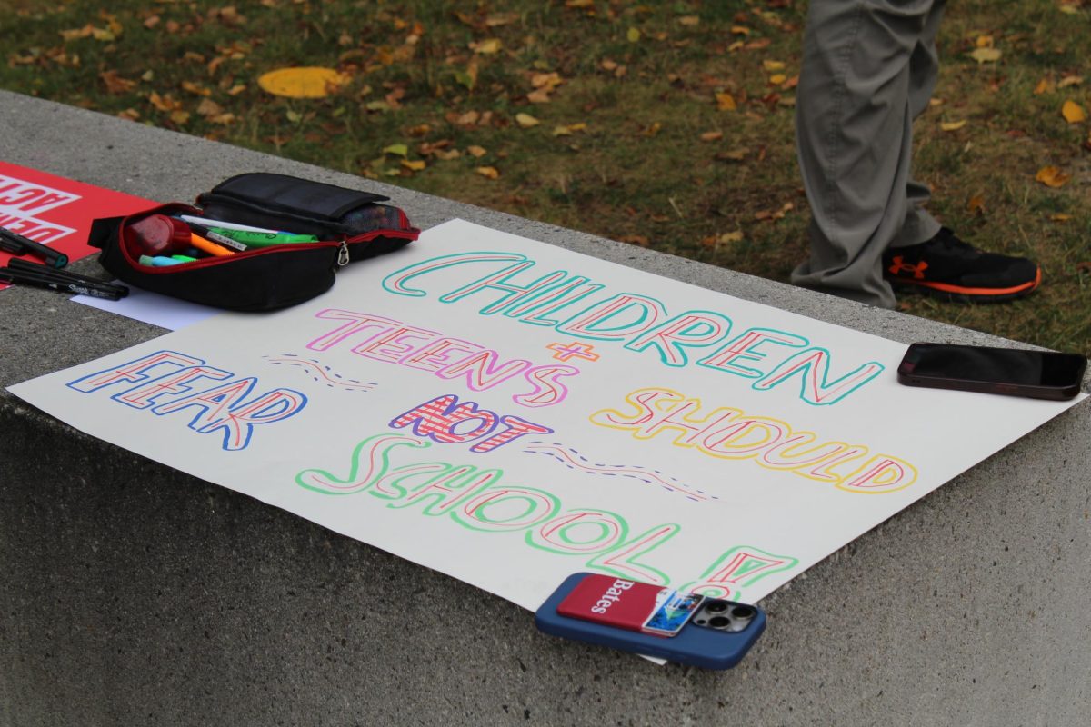One of many signs created by Bates students at the Students Demand Action walkout near Commons on Friday, September 5th. 