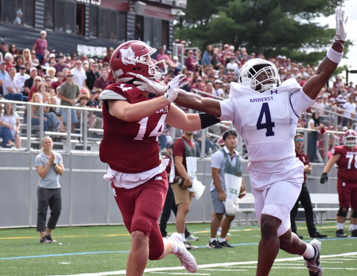 Jake Walters '27 running into the end-zone, who will soon catch the ball to score a touchdown during the Bates vs. Amherst football game.
