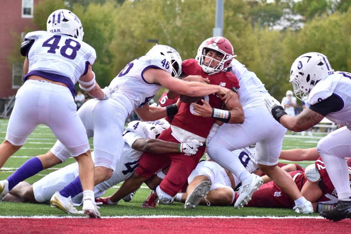 Sergio Beltran '26 making a run into the end-zone during the Bates versus Amherst football game at Garcelon Field.