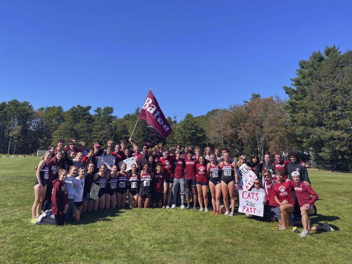 The Bates XC team takes a group photo along with fellow supporters.