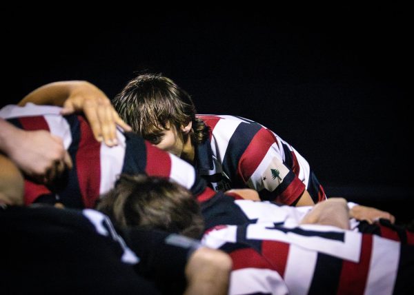 George Drake ‘28 and team in a scrum.