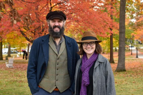 Professors Sarah Lynch and Mark Tizzoni on the Bates College Quad as a couple.