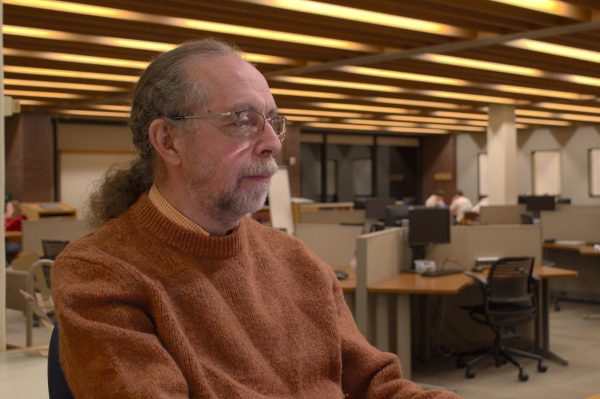 Chris Schiff works at the research desk in Ladd Library.