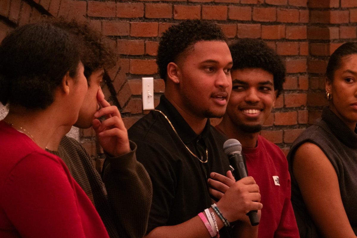 Carmel Crunk '28, a member of Bates football, speaks on the BAAC panel in recognition of Black History Month. 