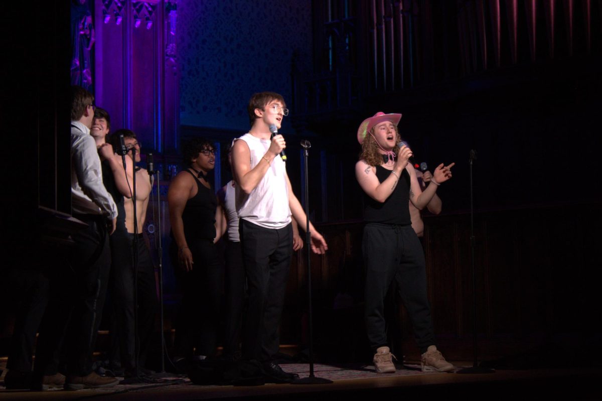 The Deansmen performing their second song at the Sex Week A Cappella concert.
