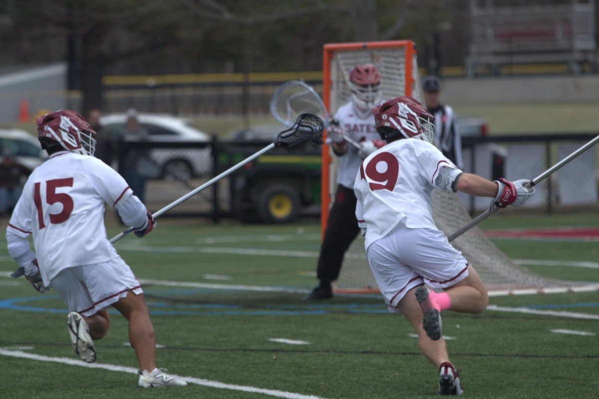 Alex Irisari '29, and Drew McClutchy '27 defending against Conn. College on April 11.