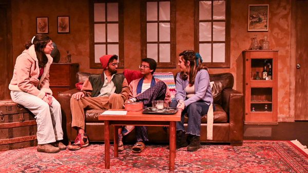 Lexi Wachen ‘26, Dylan Patel '27, Mohammad Zayd ‘27, and Bailey Lawrence ‘29 (left to right) sit on the couch during "A Midwinter Night's Tale"